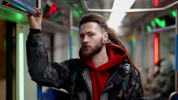 Young Man is Riding Traincar Using Underground for Transporting in Megapolis