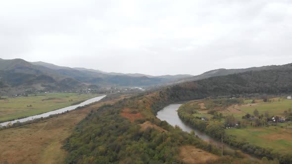 Aerial View of Crystal Clear Water in a Mountain Forest River with Pine Trees in Mountain Forest