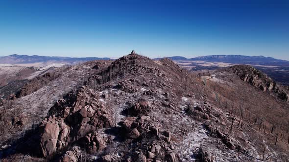 Drone shot pushing up Monjeau Peak on a sunny day in the winter