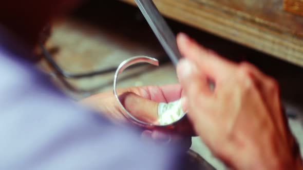 Craftswoman preparing ring