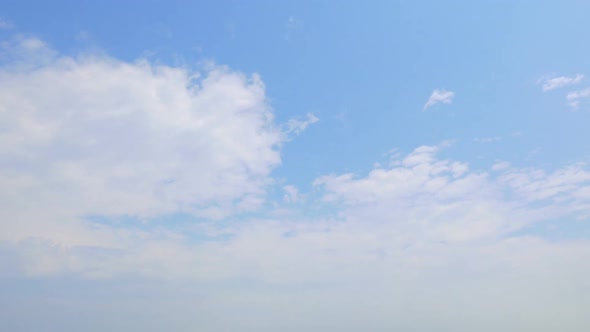 Time lapse of white cloud moving pass around sky background