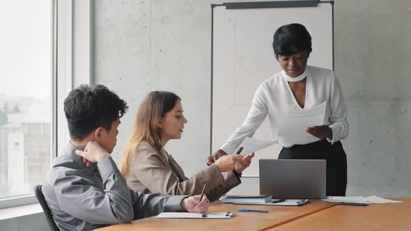 African Successful Business Woman Leader Coach Mentor Consultation in Company Office Gives Paper