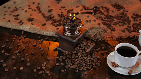 Teapot and Cup Coffee on Saucer with Cinnamon and Anise