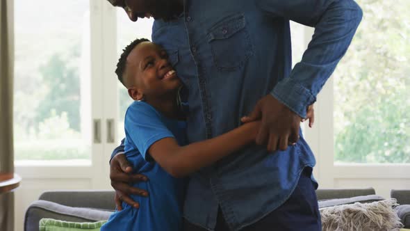 Father and son hugging each other