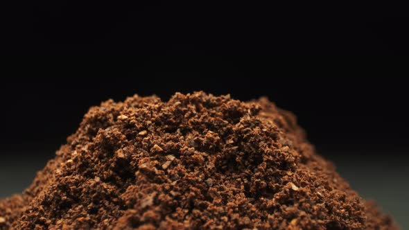 Falling Coffee Bean. Ground Coffee. Close-up.