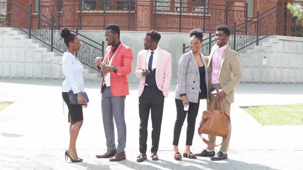 African Students Are Making Up a Plan of a Future Business in the Street