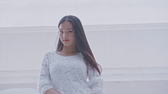 Young Asian Girl Pose And Looking At Camera