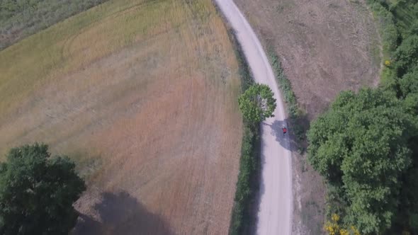 Man cycling with mountain bike on countryside road