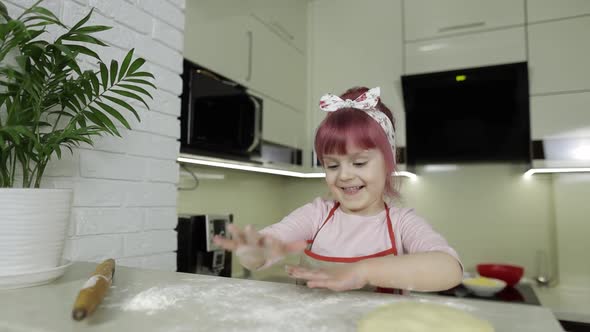 Cooking Pizza. Little Child Playing with Flour Gets Her Hands Dirty in Kitchen