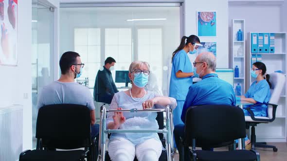 Disabled Senior Woman with Walking Frame