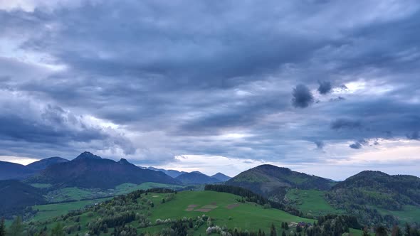 Spring Landscape with Cumulative Clouds A Huge Storm Cloud Forms Over the Mountains at Dusk