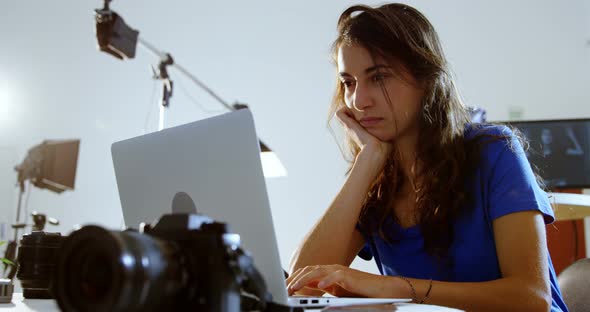 Female model using laptop