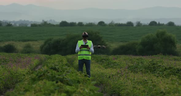 Farm Specialist Engineer Using Technology VR Monitoring Drone Harvest Working for Agriculture