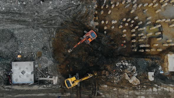 Drone Top View Excavators Digging Pit for Building Foundation for a Multi-story Building