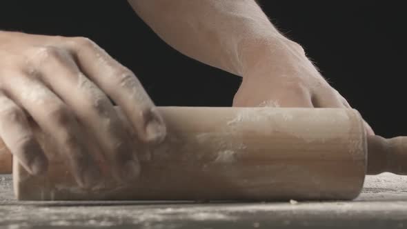 Male Hands Take Piece of Dough After Rolling Out