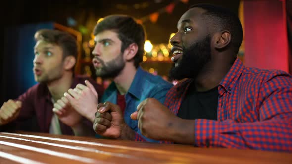 Happy Friends Celebrating Soccer Team Scoring Goal, Shouting and Gesticulating