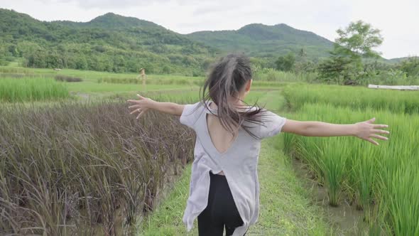 Happy Girl Running In Rice Field