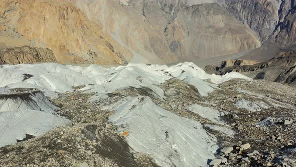 aerial drone flying low and slow over passu glacier in hunza pakistan during a summer day with lots