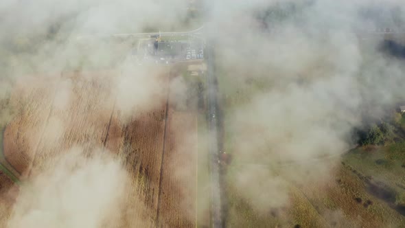 Car speeding to village top view from clouds