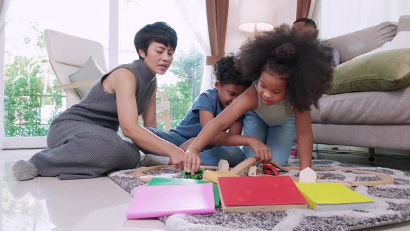 Small mixed-race kids boy and girl playing toy cars, children development concept