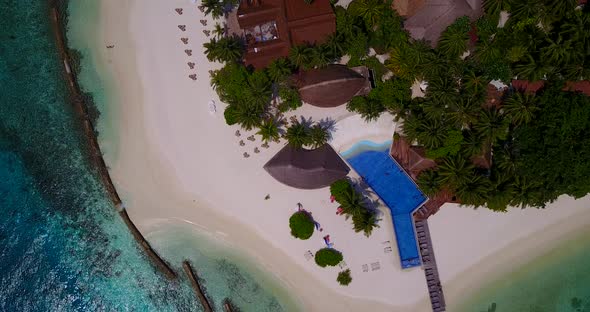 Luxury above abstract view of a white paradise beach and aqua turquoise water background in colourfu