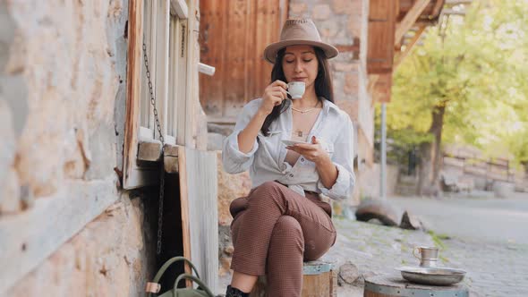 Woman Drinking Coffee Outdoors