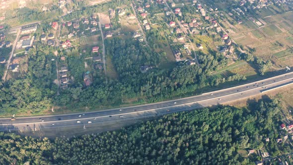 Traffic on the Country Autobahn Near the Cottage Village  Aerial Video