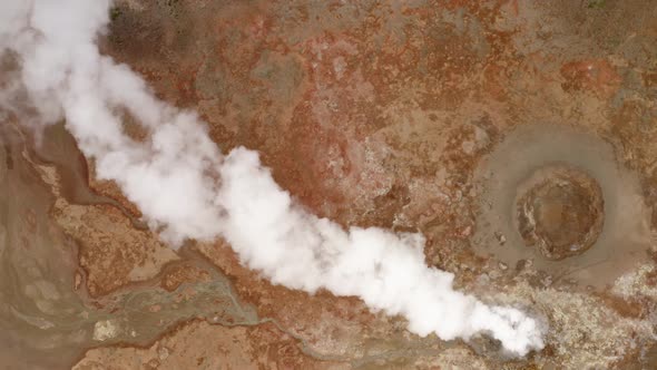 Steaming Fumarole In Geothermal Area In Iceland - aerial top down