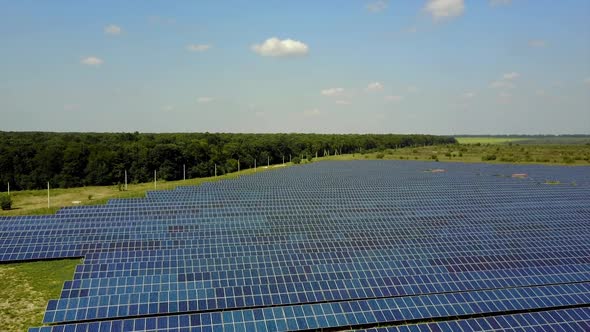 Solar Energy Panels In Field. Solar battery power plant on green meadow