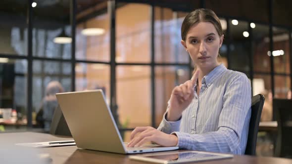 No Rejecting Young Woman Waving Finger at Work