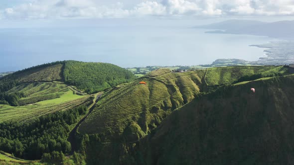 Parachutists Flying in Sky Over Landscape of Miradouro Do Cerrado Das Freiras