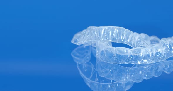 Braces for Teeth Whitening on a Blue Background.