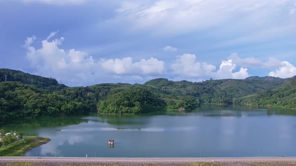 Aerial view Drone Hyperlapse shot of Tropical landscape rainforest with clouds flowing over mountain alt