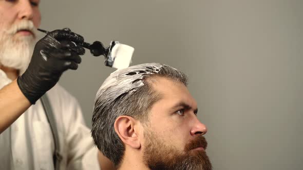 Man Dye Hair Blond Color at Barbershop Salon