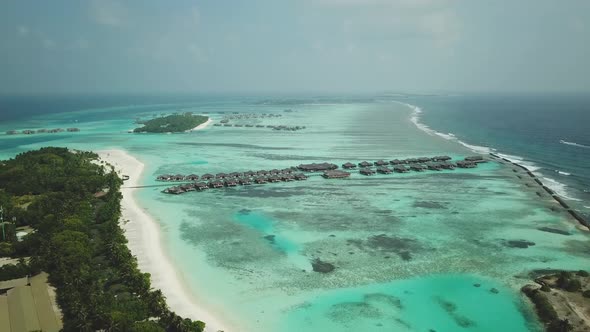 Aerial Drone View of a Beautiful Atoll or Island with a Resort in the Maldives