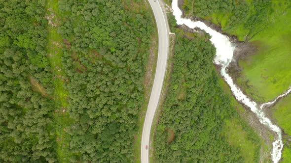 Aerial View Of Vehicles Driving On Road At Forest Valley To Stryn In Norway. - Tracking Shot