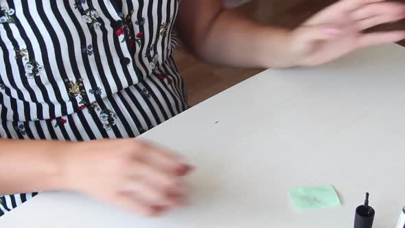 A Woman Works With A Nail File. Does A Manicure. Close Up Of Hands And Palms.