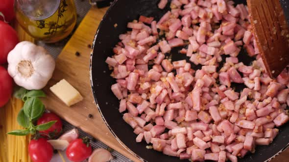 Making Pasta Carbonara  Mixing Chopped Pancetta Bacon in Frying Pan