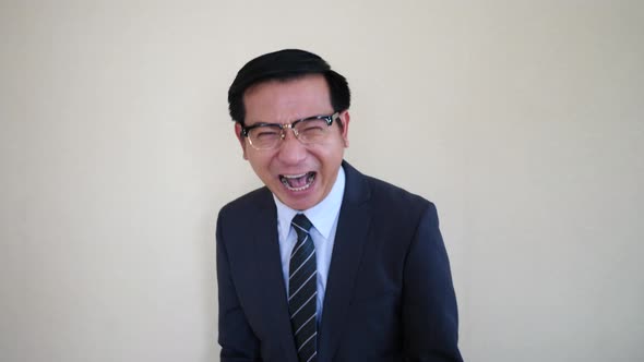 Happy Businessman laughing look at camera