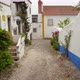 Flowers and Greenery Grows in Old Ancient Street in Castle of Óbidos - VideoHive Item for Sale