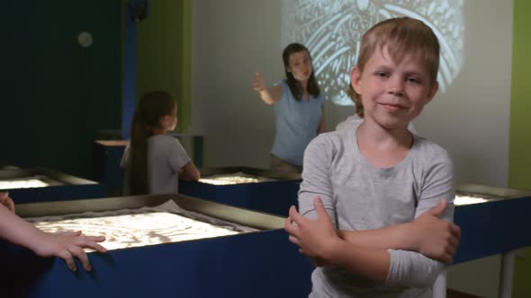 Cute Boy Posing in Sand Animation Class