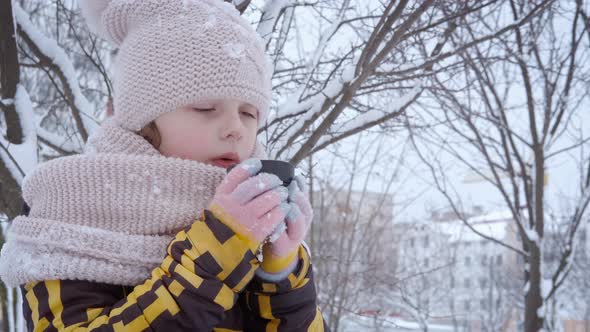 Child with Thermos in Winter