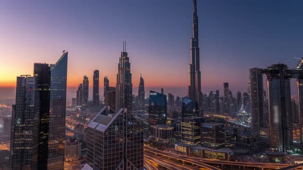 Dubai Downtown Skyline with Tallest Skyscrapers and Busiest Traffic on Highway Intersection Night to