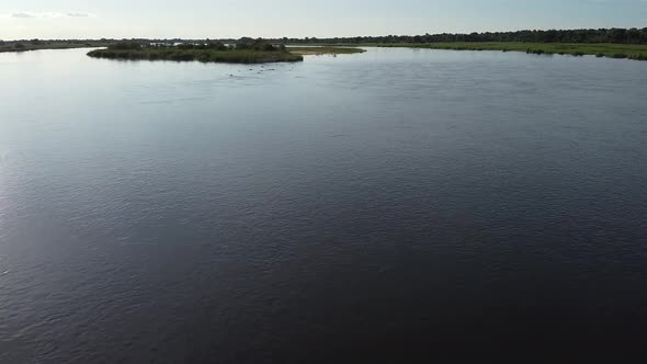 Big river in Namibia with lots of hippos swimming in it, wildlife of Africa