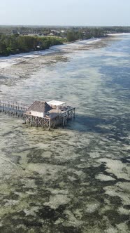 Tanzania  Vertical Video House on Stilts in the Ocean on the Coast of Zanzibar Slow Motion