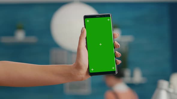 Hands of Freelencer Holding Vertical Mock Up Green Screen Chroma Key Smartphone