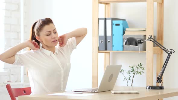 Tired Relaxing Woman  Working on Laptop