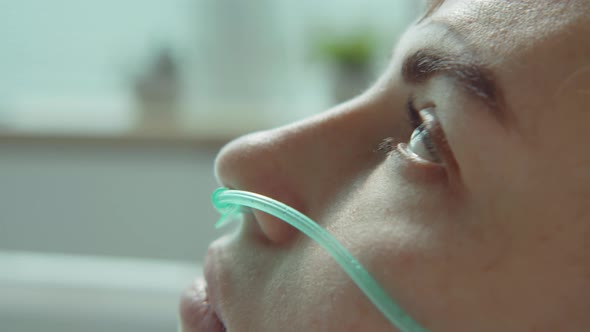 Woman with Nasal Cannula Lying in Clinic