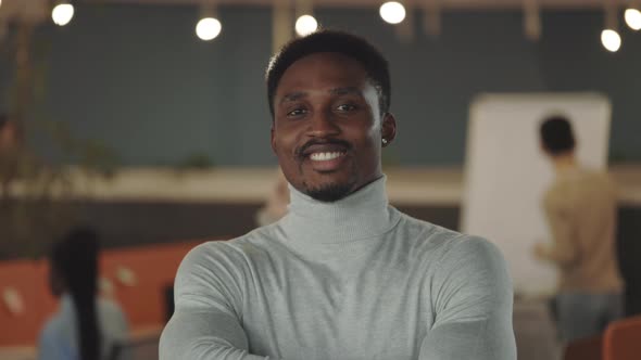 Portrait of Smiling Office Manager Looking to Camera at Coworking Zone