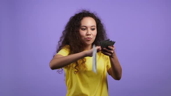 Curly Haired Woman with Happy Face Scatters Money